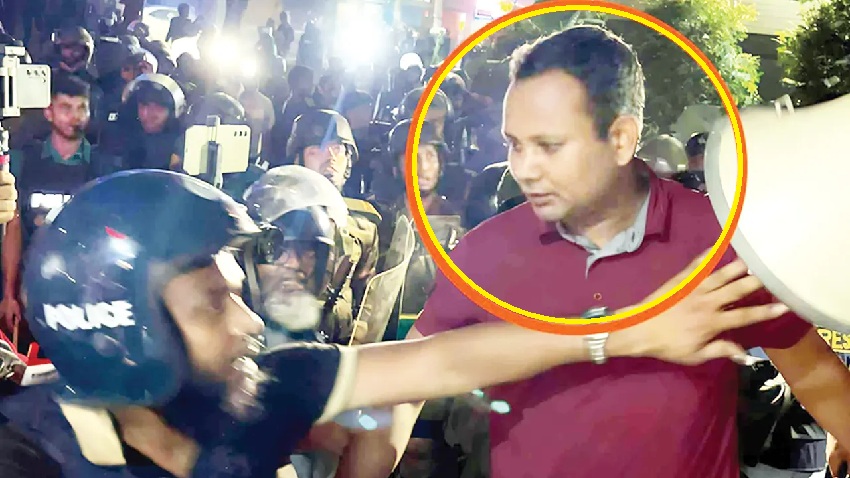মেরুন রঙের টি-শার্ট পরিহিত সেই ব্যক্তি পল্টন থানার ওসির গাড়িচালক